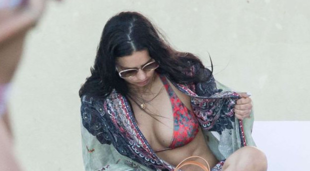 Adriana Lima vacationing in a Bikini at a Swimming Pool in Miami. 